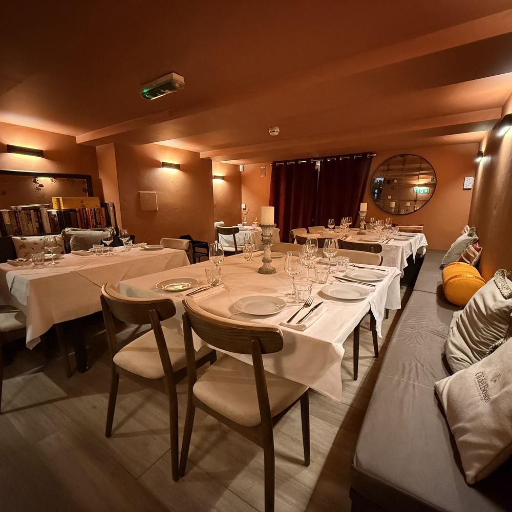 The semi-private dining room set for a group celebration at Arianna Trattoria Romana