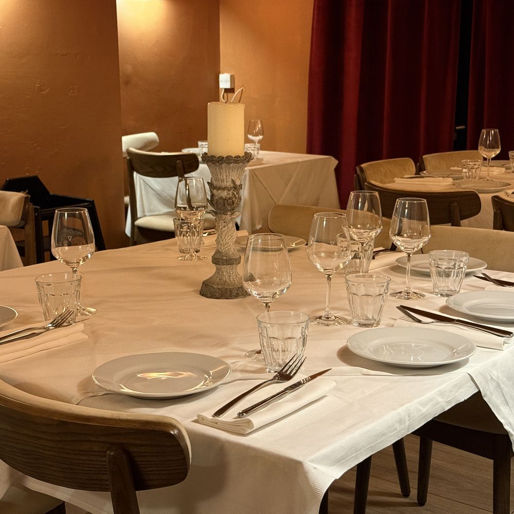 Candlelit detail in the semi-private dining room at Arianna Trattoria Romana